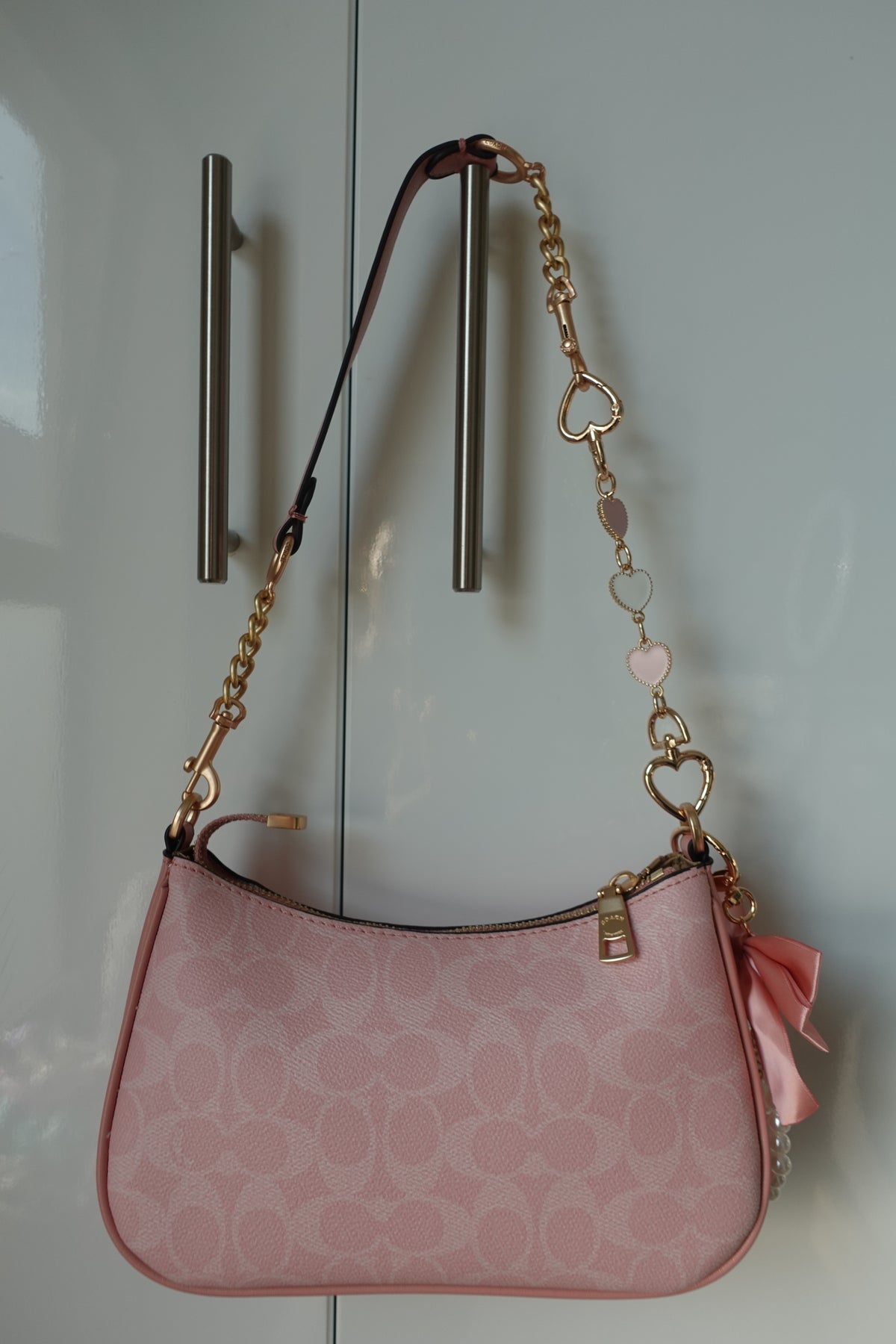 Pink Teri with heart handle extenders + bow charm