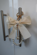 White bow charm